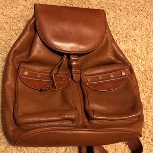 Brown leather backpack with silver studs